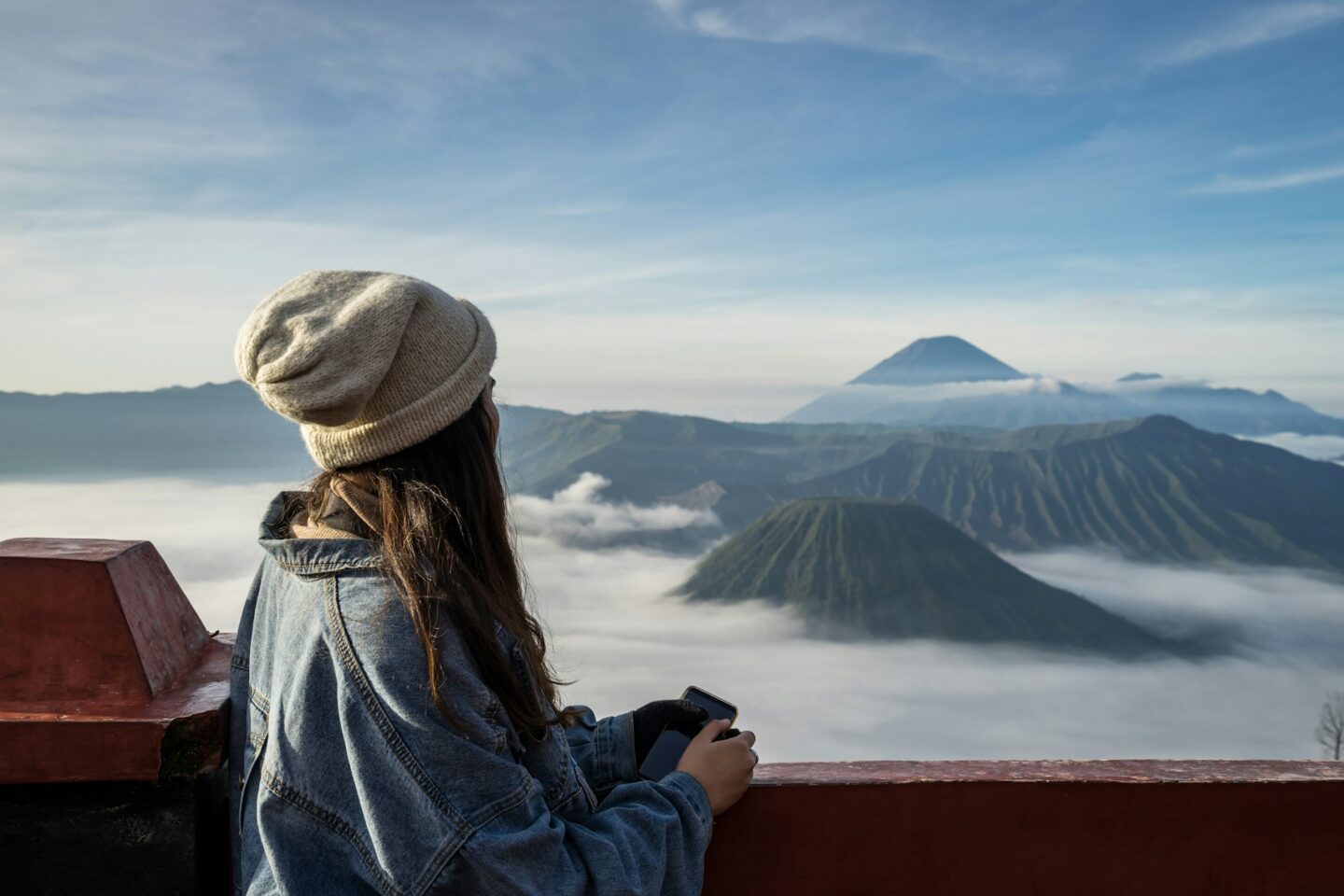 Young traveler looking at beautiful view of Mount Bromo volcano