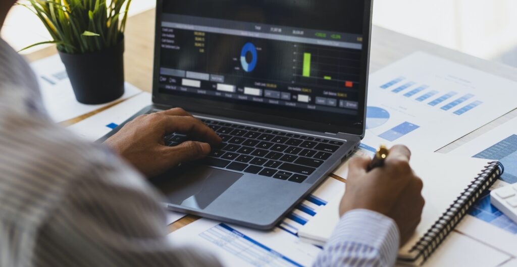 Businessman analyzing investment situation and business chart for financial planning.